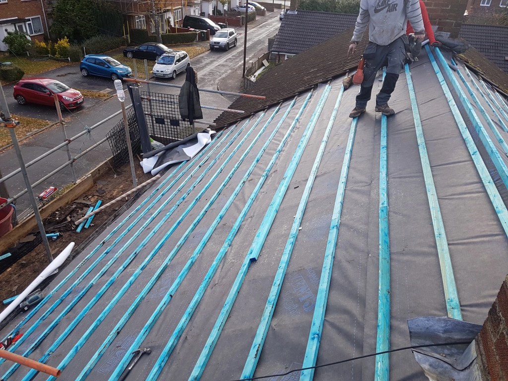 New roofing membrane and battens before replacement tiles are laid